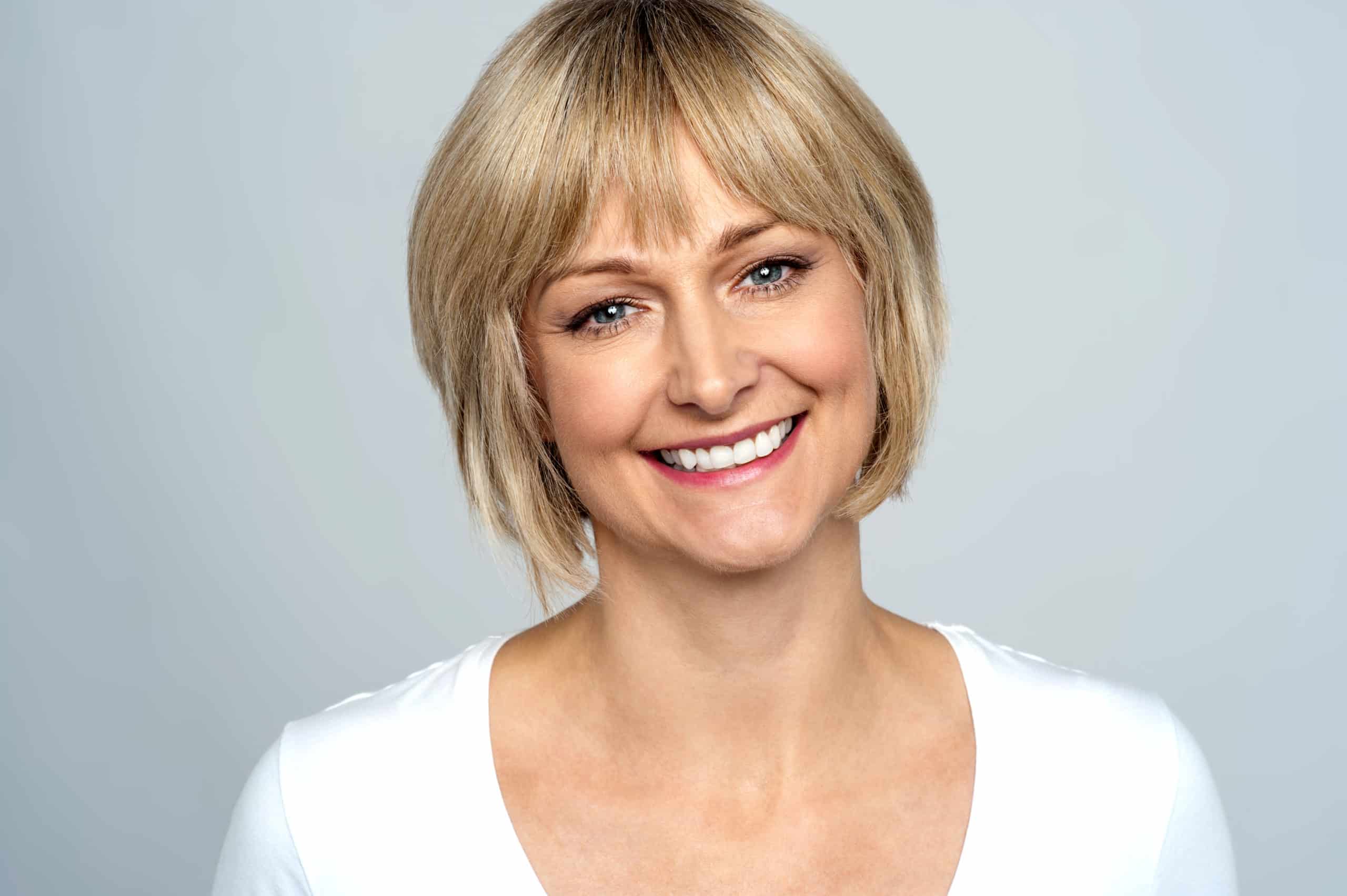 Everything You Wanted To Know About Invisalign woman wearing Invisalign