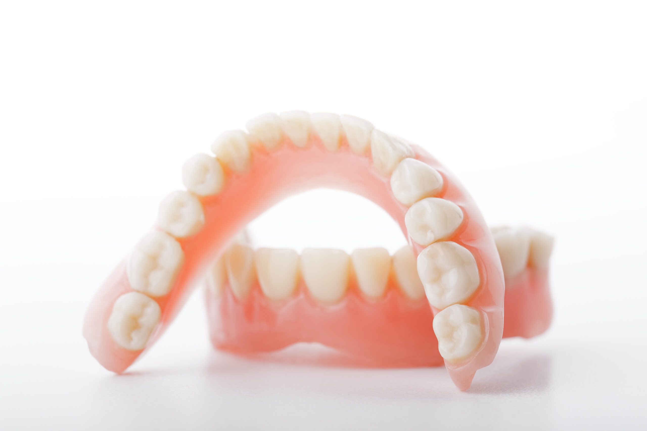 Finding the Right Dentures for You medical denture smile jaws teeth on white background